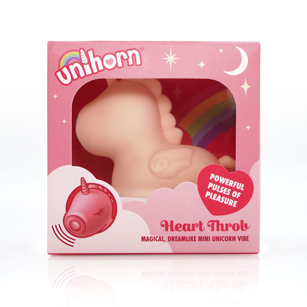 Front view of the Unihorn - Pink heart throb - pulsing clitoral stimulator  in the packgaging on a white background | Flirty Bay adult store and lingerie store