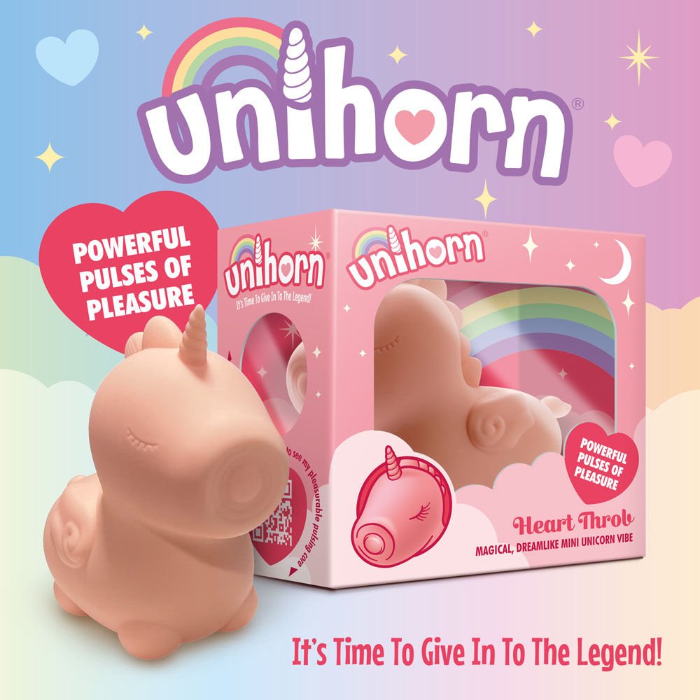 Side view of the Unihorn Heart Throb pulsing clitoral stimulator and its packaging on a whimsical fairy-themed background | Flirty bay adult store and lingerie store