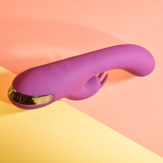 Top bak view of the Playboy Pleasure Thumpur thumping rabbit vibrator, on a pink and yellow background | Flirty Bay adult store and lingerie store