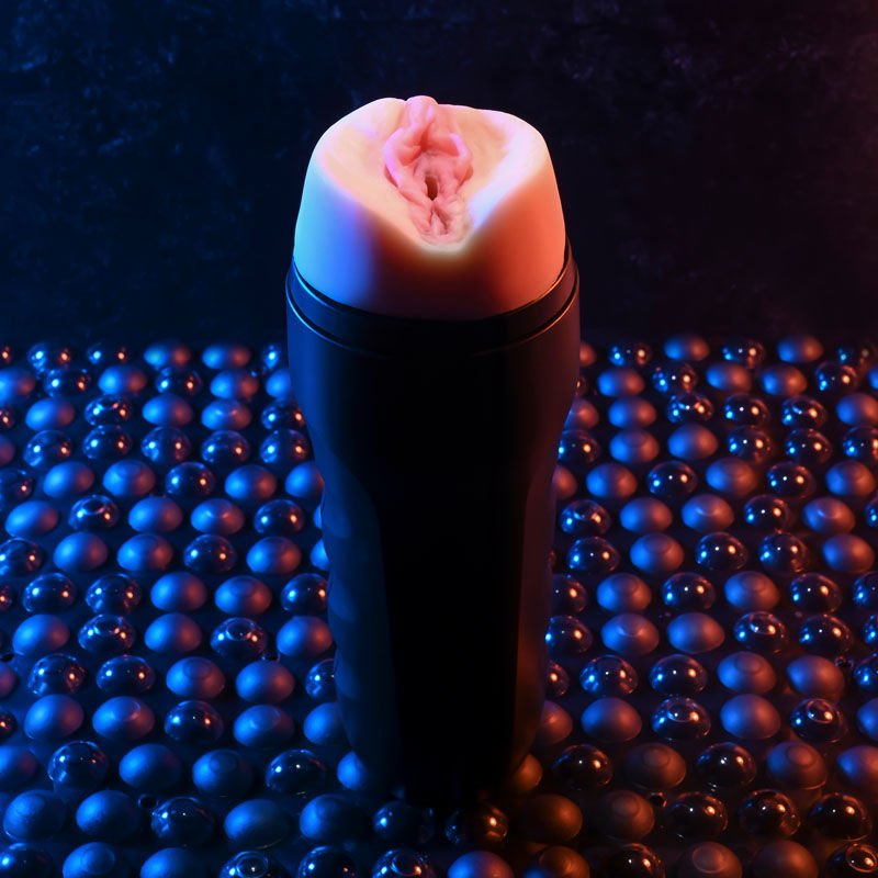 Front view of the Zero Tolerance Grip It Light masturbator with the cap open, close-up on the realistic vagina, on a warm purple background | Flirty Bay adult store Perth