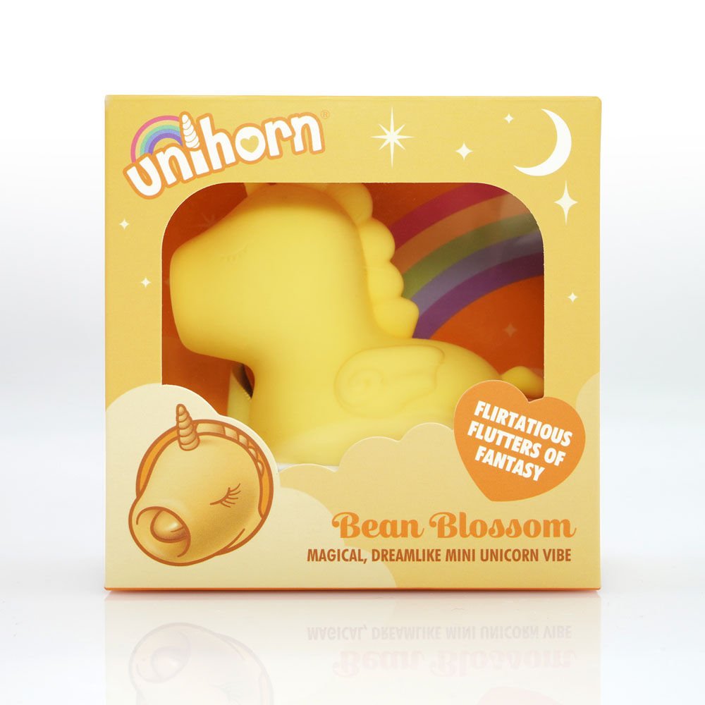 Packaging of the yellow Unihorn Bean Blossom clitoral stimulator, with the small vibrator visible inside the box, set against a clean white background | Flirty bay adult store and lingerie