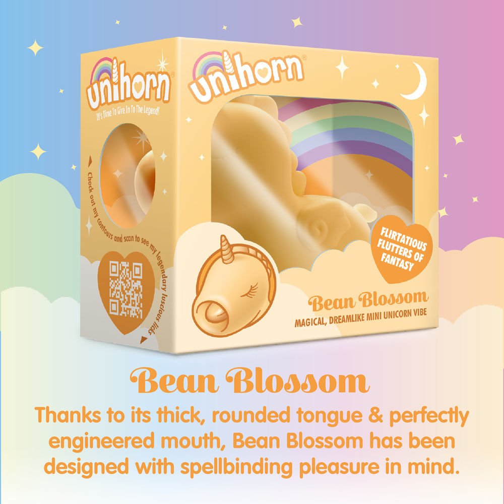 Side view of the packaging of the yellow Unihorn Bean Blossom clitoral stimulator, with the small vibrator visible inside, set against a fairy-themed background | Flirty bay adult store and lingerie store