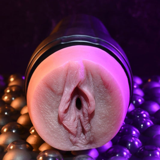 Front close-up view of the Zero Tolerance Grip It Light Tan male masturbator focusing on the realistic vagina detail, on a warm purple background | Flirty Bay adult store Perth