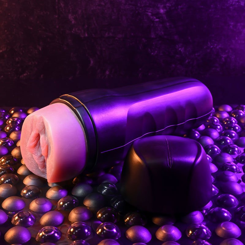 Side view of the Zero Tolerance Grip It Light Tan pocket pussy male masturbator with the cap open, showing the entry point, on a warm purple background | Flirty Bay adult store Perth