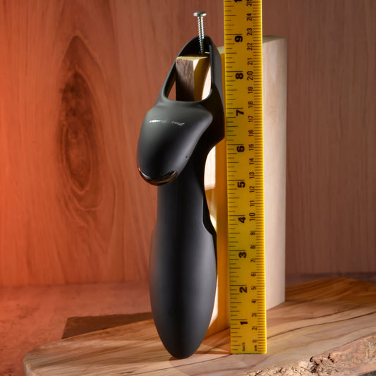 One front view of the Zero Tolerance - Nautilus - Rechargeable Vibrating Penis Extender with a ruler for size reference, on a wooden background | Flirty Bay, male sex toys in Perth Australia