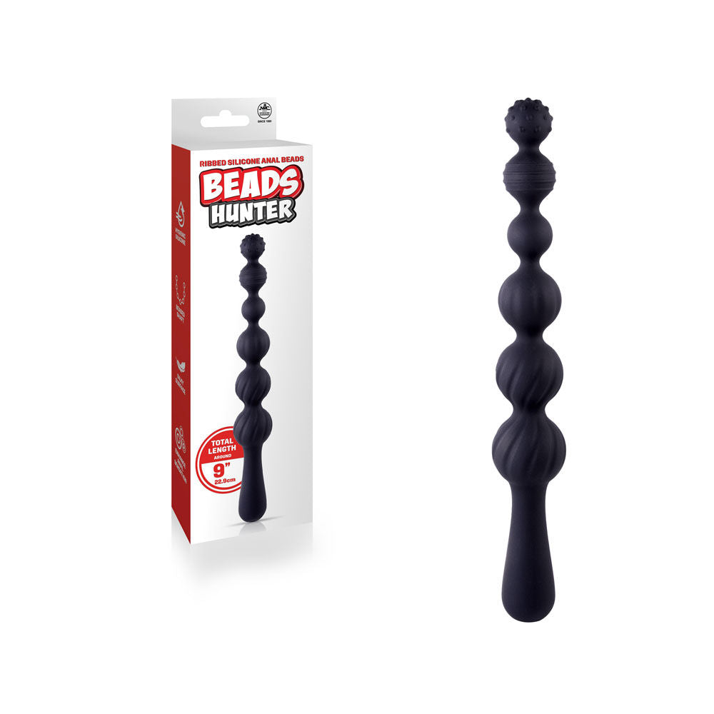 Front view of black silicone anal beads with packaging on the left side, featuring smooth beaded shaft and hygienic silicone design | Flirty Bay, anal plug adult store Australia
