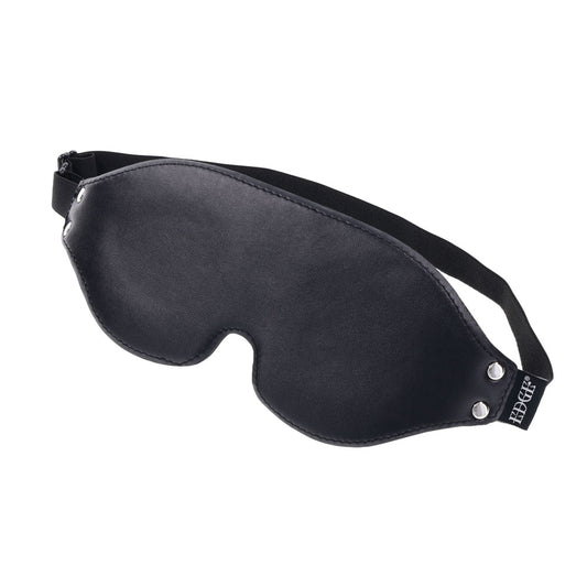 Side view of the EDGE Lights Out Blindfold showing its smooth black faux leather exterior and padded shape | Flirty Bay adult toys online, best sex tools