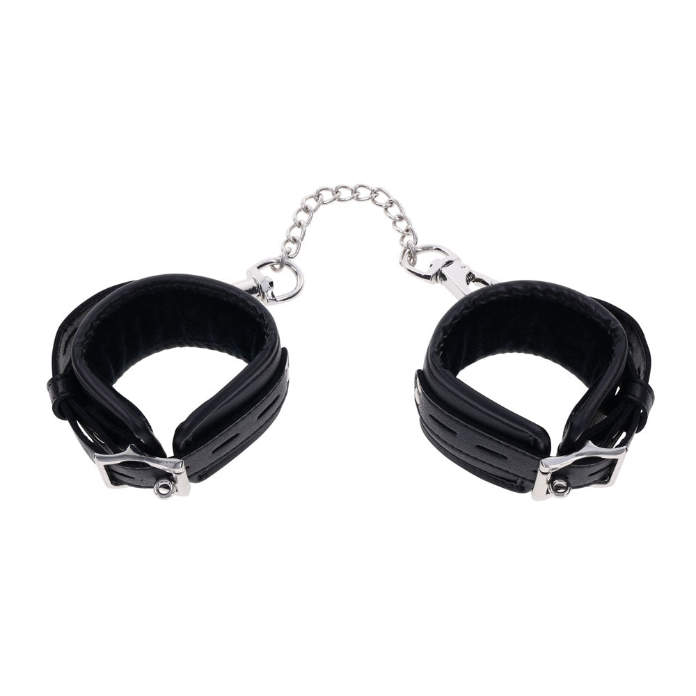 Top view of EDGE handcuffs with both cuffs closed, showcasing the sleek black design and silver buckles | Flirty Bay adult toys online, best sex tools
