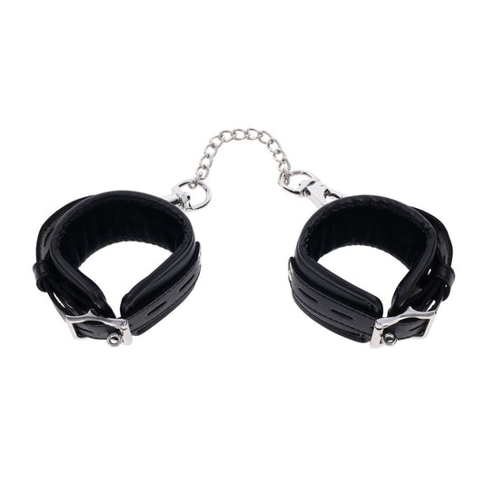 Top view of EDGE sex handcuffs with both cuffs closed, showcasing the sleek black design and silver buckles | Flirty Bay adult toys online, best sex tools
