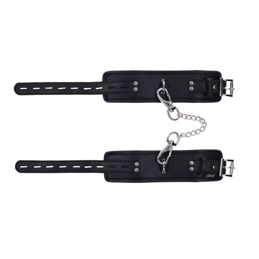 Top view of EDGE sex handcuffs showing the black faux leather exterior and silver metal buckle | Flirty Bay adult toys online, best sex tools
