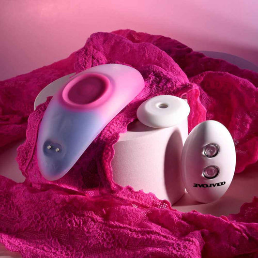 Side view of the Evolved Paradise Panty Pink Purple Rechargeable Vibrating Panties inside a panty with remote control in a pink and purple decor | Flirty Bay, vibrator panties in Perth Australia