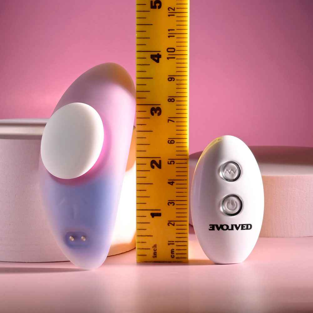 Front view of the Evolved Paradise Panty Pink Purple Rechargeable Vibrating Panties with remote control and ruler for size reference in pink and purple decor | Flirty Bay, vibrator panties in Perth Australia