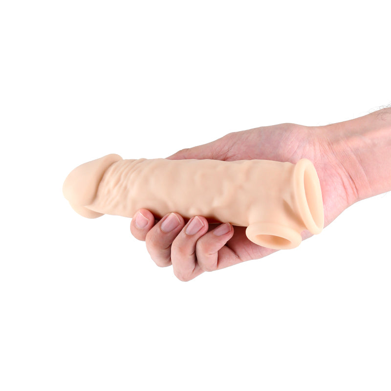 Flesh Renegade Annex Thick Penis Extender 7.3” in a man’s hand | Flirty Bay, male sex toys in Perth Australia