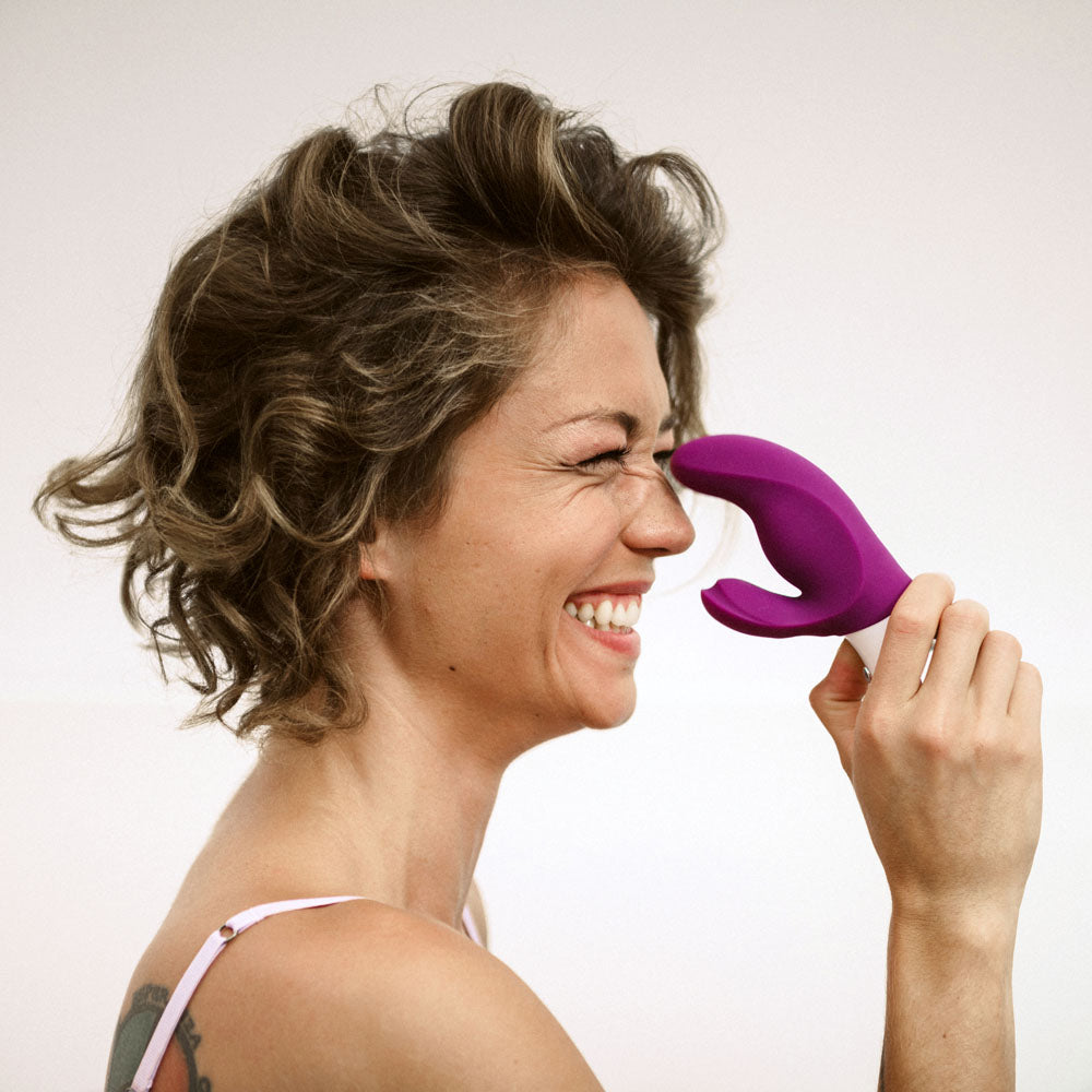 Miss BI rabbit vibrator held by smiling model showcasing user-friendly size and shape | Flirty Bay, anal plug adult store Australia