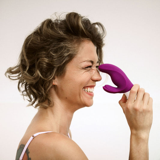 Miss BI rabbit vibrator held by smiling model showcasing user-friendly size and shape | Flirty Bay, anal plug adult store Australia