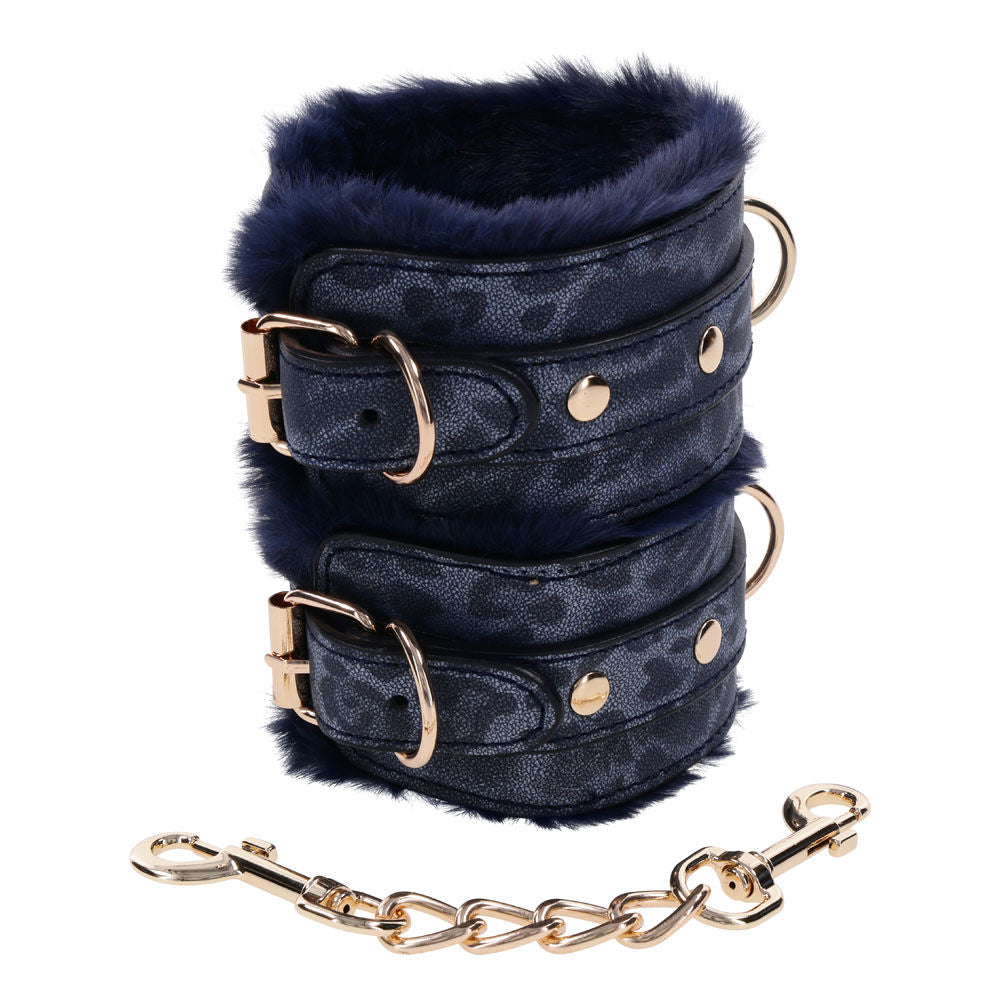 Navy blue faux fur handcuffs with gold chain and buckles for luxurious bondage play | Flirty Bay online adult store, adult toys and lingerie