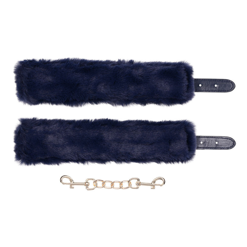 Navy blue faux fur handcuffs with gold chain and buckles for luxurious bondage play, unfolded handcuffs back view | Flirty Bay online adult store, adult toys and lingerie