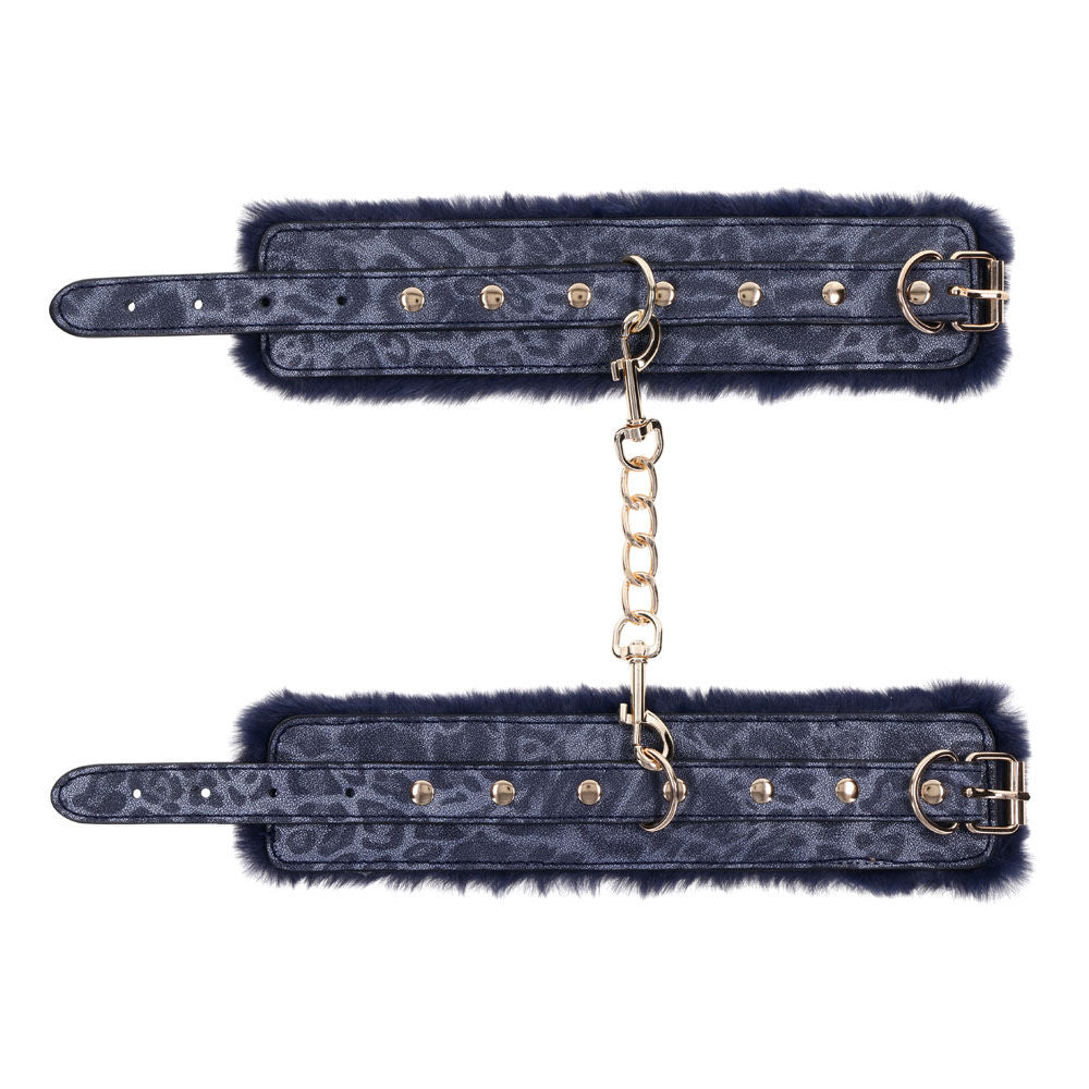 Navy blue faux fur handcuffs with gold chain and buckles for luxurious bondage play, unfolded handcuffs top view | Flirty Bay online adult store, adult toys and lingerie