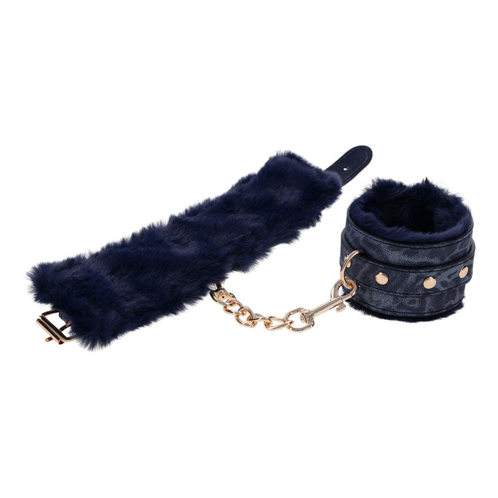 Navy blue faux fur handcuffs with gold chain and buckles for luxurious bondage play, unfolded handcuffs view | Flirty Bay online adult store, adult toys and lingerie