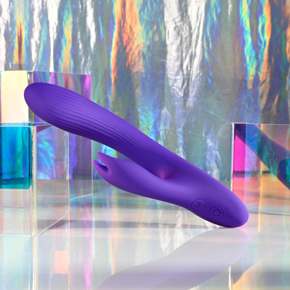 Side view of Selopa Poseable Bunny Rabbit Vibrator in a disco decor | Flirty Bay, sex toys Australia