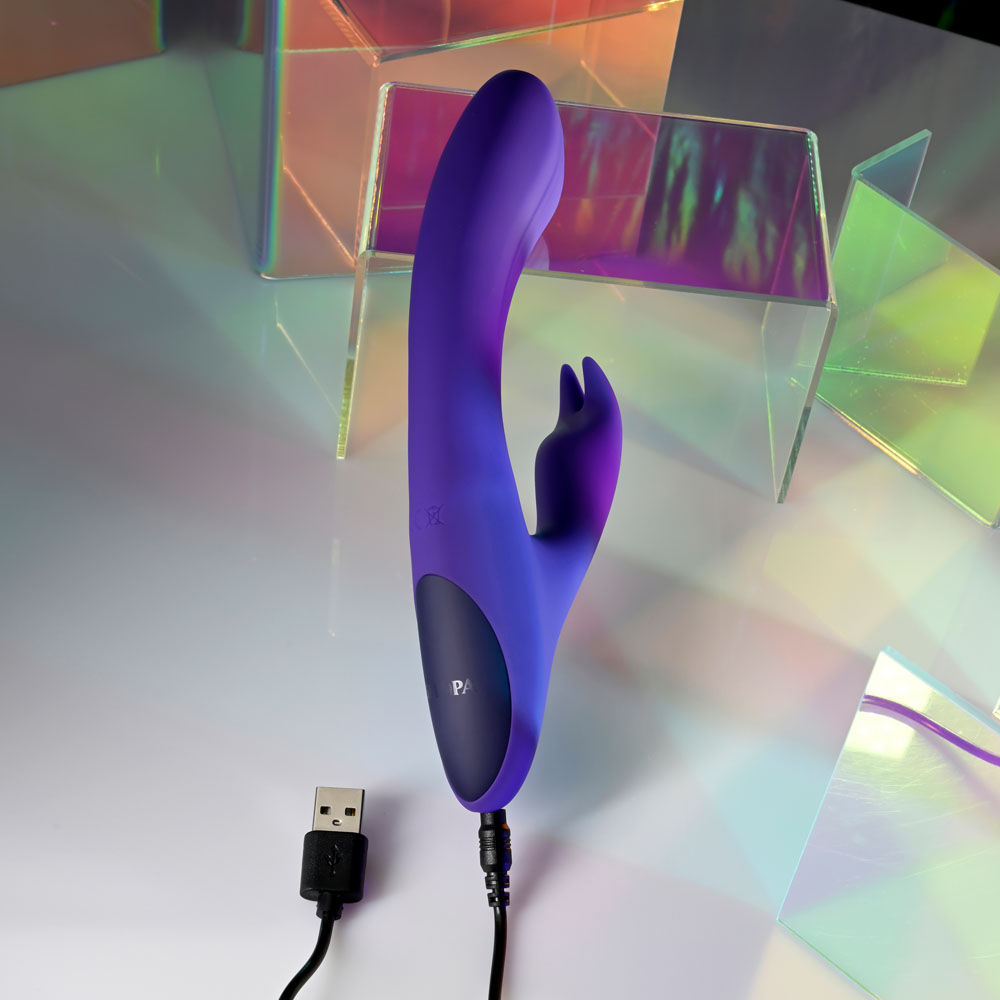 Top view of Selopa Poseable Bunny Rabbit Vibrator showing rechargeable USB plug in a disco decor | Flirty Bay, sex toys Australia
