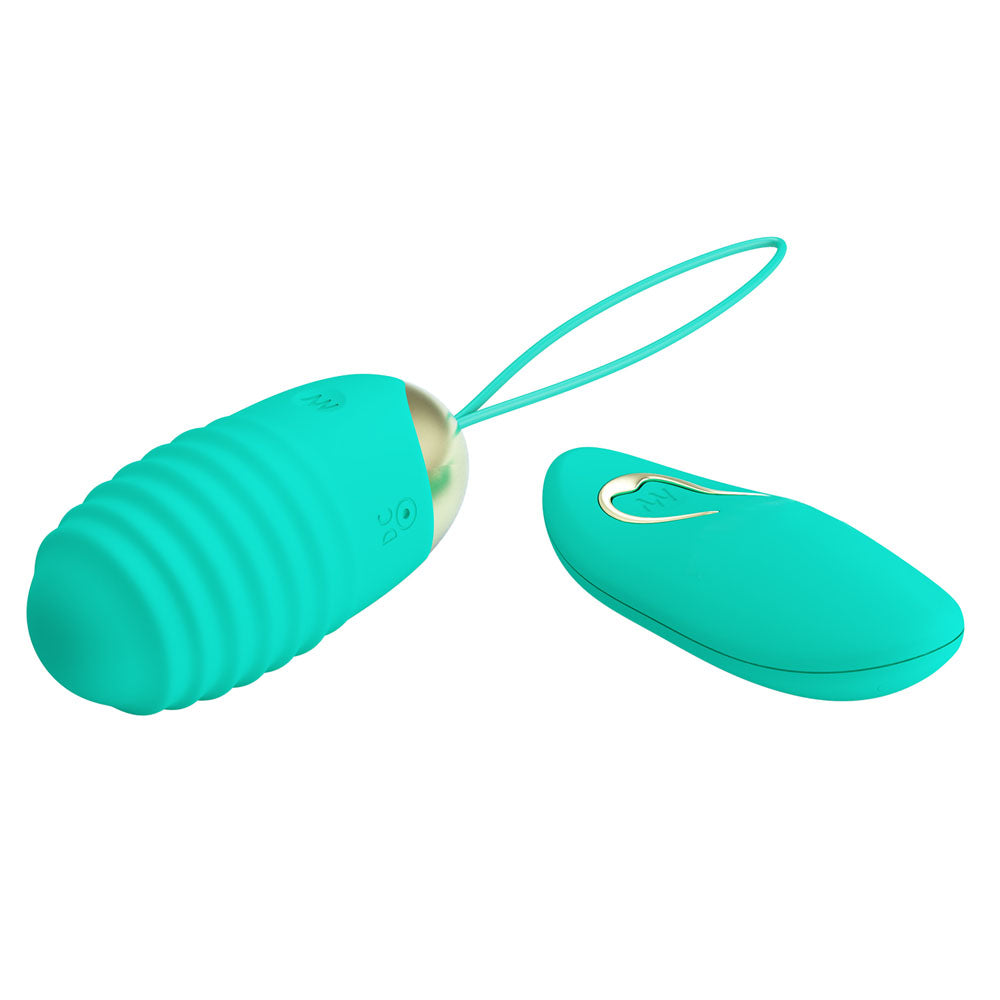 Top view of the teal Party Up Ivan egg vibrator with its wireless remote on the right side on a white background | Flirty Bay, sex toys Australia