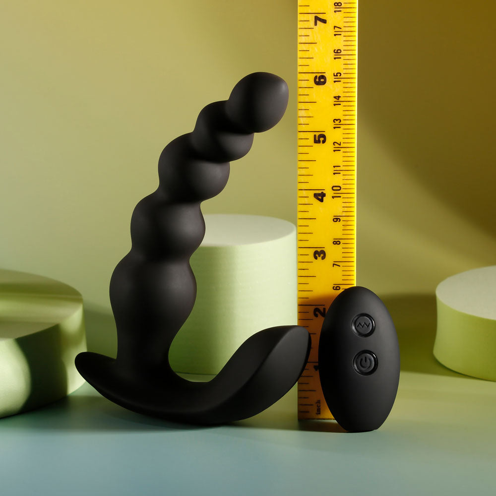 Side view of vibrating anal beads and remote with ruler for precise size reference | Flirty Bay, anal plug adult store Australia