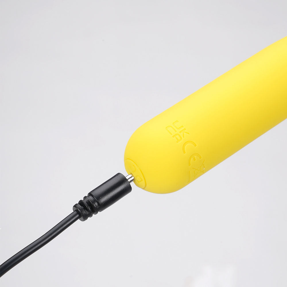 Top view of the yellow Maia Tawni bullet vibrator with close-up of the charger port | Flirty Bay, sex toys Australia