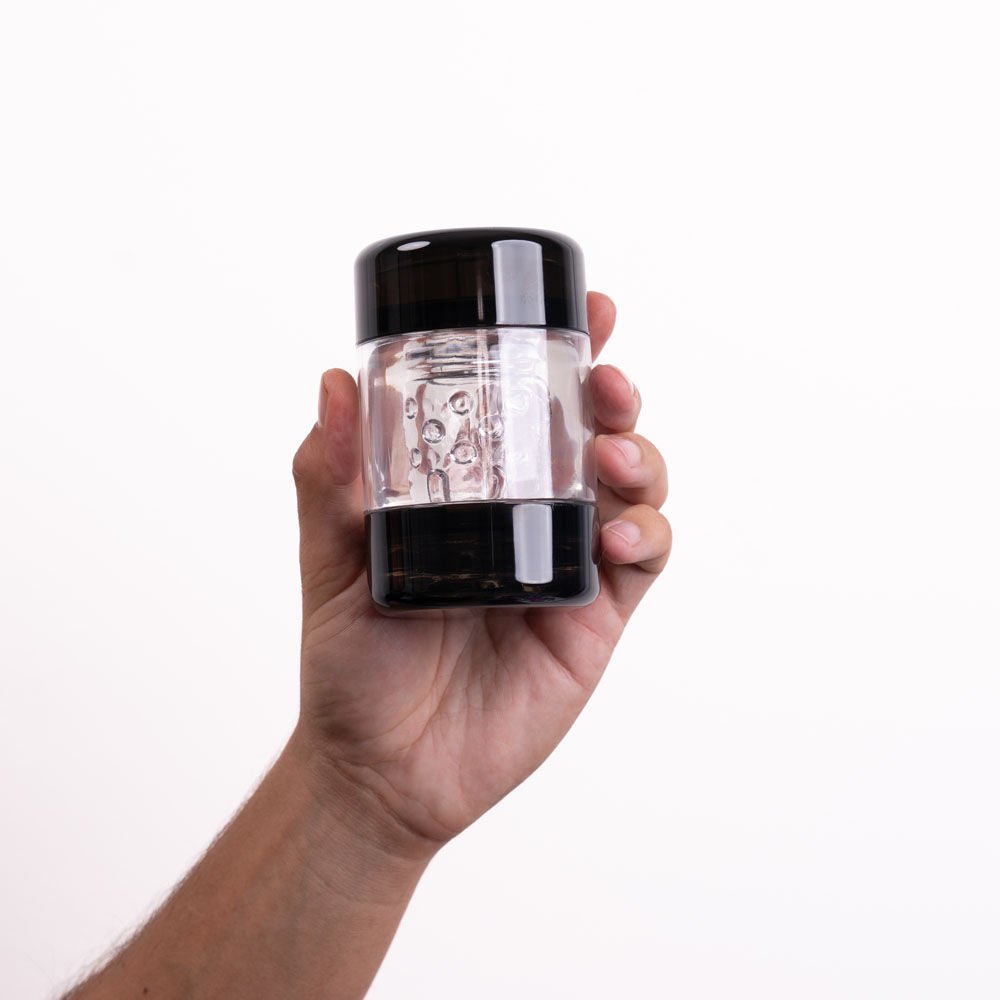 Maia Anson Hard Cup Stroker masturbator closed and held in a hand on a white background | Flirty Bay adult store Perth