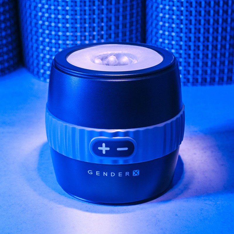 Front top view of the Gender X Barrel Of Fun Stroker Male Masturbator presented on a blue decorative background, highlighting the product’s design and contours. | Flirty Bay adult store Perth