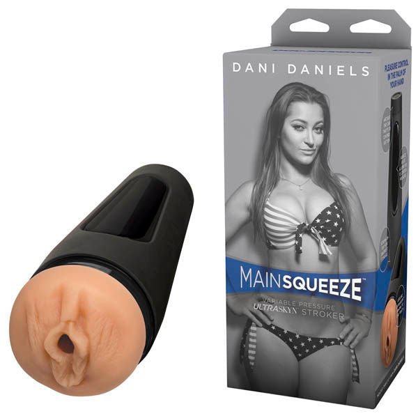 Side view of the Main Squeeze Dani Daniels Realistic Vagina Male Masturbator alongside its packaging, highlighting the lifelike flesh tone and detailed vulva texture on a clean white background. | Flirty Bay adult store Perth