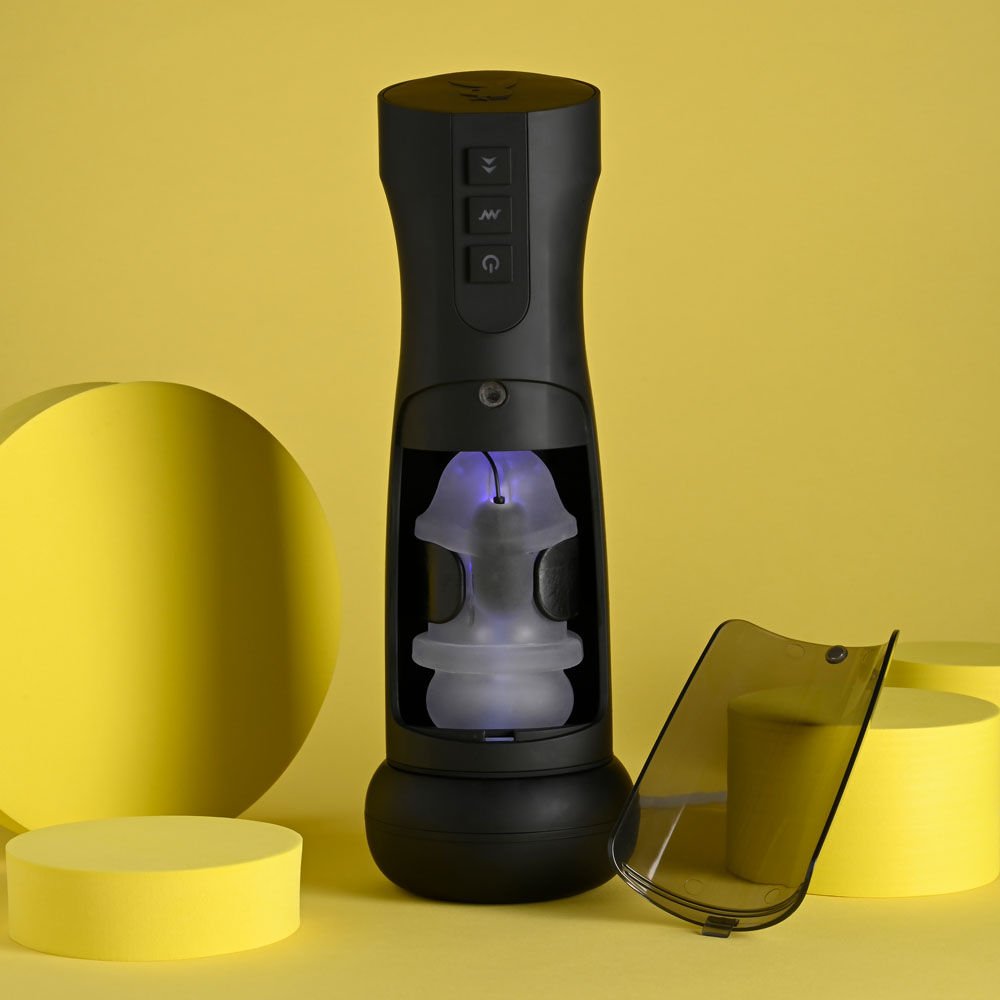 Back view of the Playboy Pleasure End Game vibrating stroker showing internal beads, set against a yellow background | Flirty Bay adult store Perth