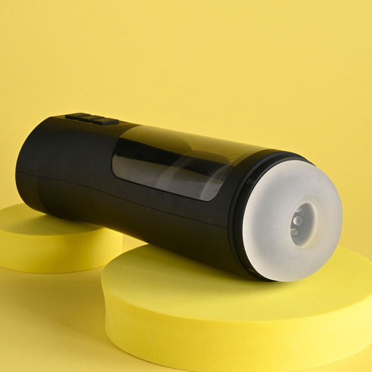 Side view of the Playboy Pleasure End Game vibrating stroker with packaging on a clean yellow background | Flirty Bay adult store Perth