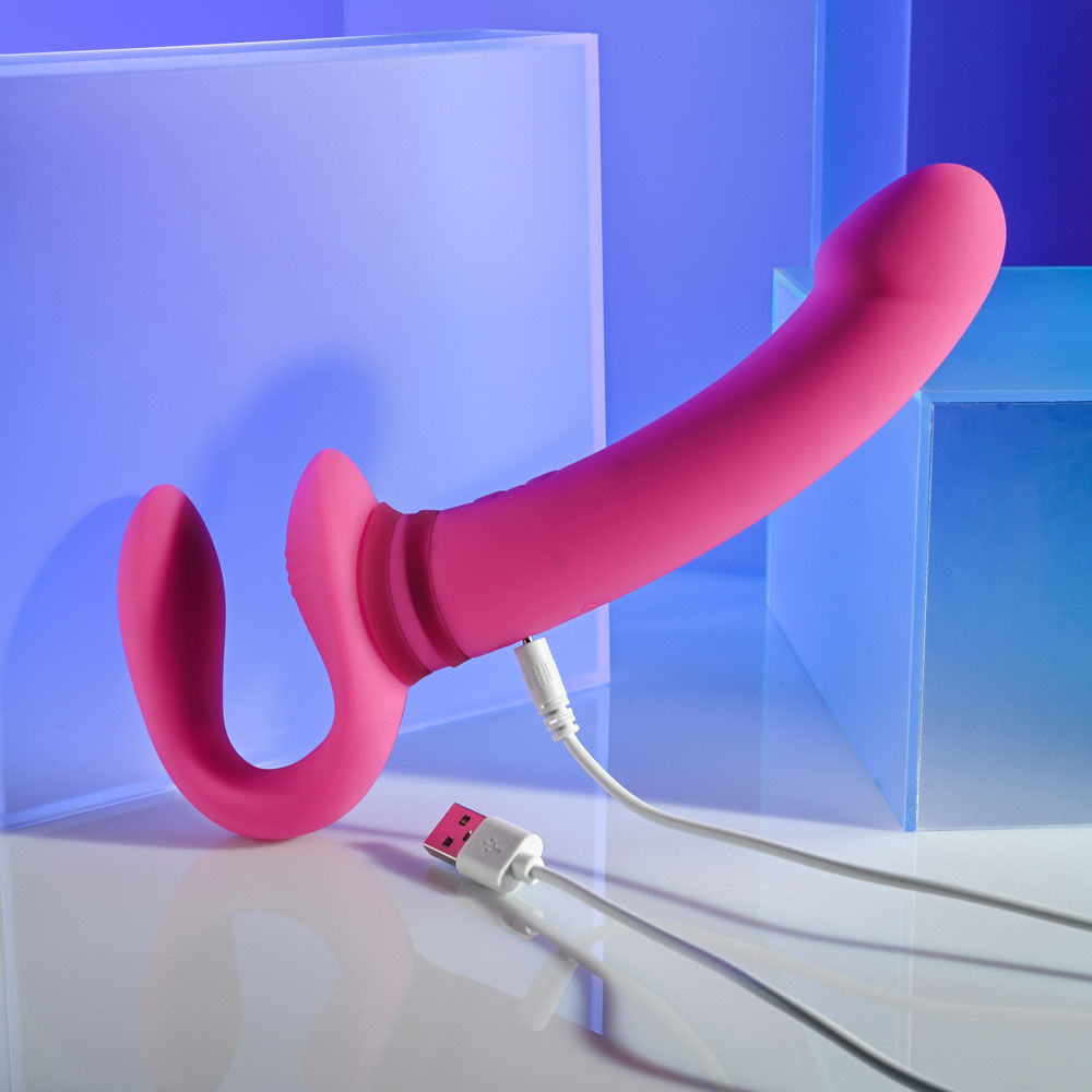 Gender x sharing is caring - strapless strap-on - Product side view, focus on charger  | Flirtybay.com.au