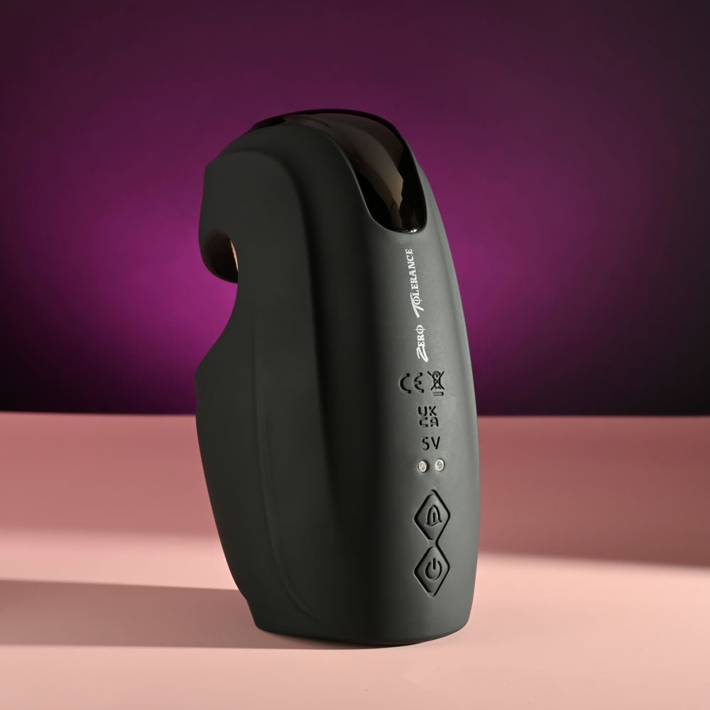 Back view of the Zero Tolerance Lick the Tip vibrating male masturbator, highlighting the control panel and overall design, against a purple and pink background | Flirty Bay adult store Perth