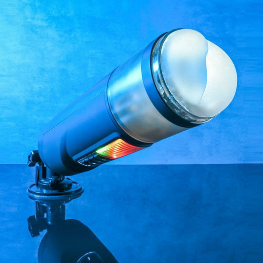 Side view of the Gender X Message in a Bottle Stroker Male Masturbator focusing on the sturdy suction cup base, set against a blue decorative background. | Flirty Bay adult store Perth