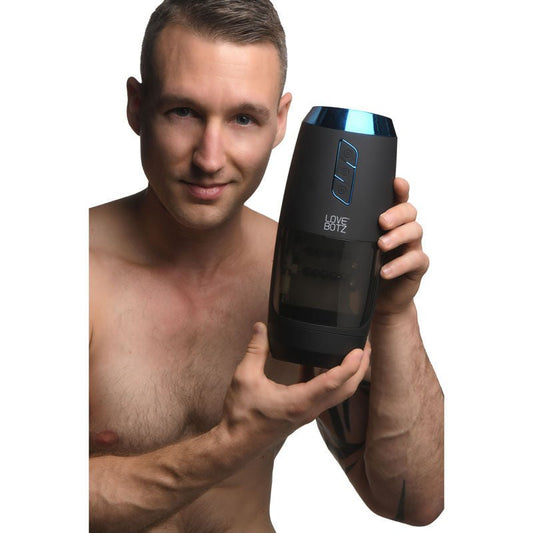 LoveBotz The Milker Slider 18X stroking male masturbator held in a man's hand, demonstrating size and grip, on a neutral background | Flirty Bay adult store Perth