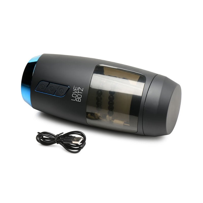 Side view of the LoveBotz The Milker Slider 18X masturbator with charger cable connected, highlighting the charging point, on a clean white background | Flirty Bay adult store Perth