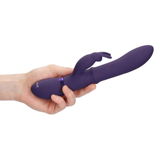 Vive - halo - rabbit vibrator - Product side view, in a hand  | Flirtybay.com.au