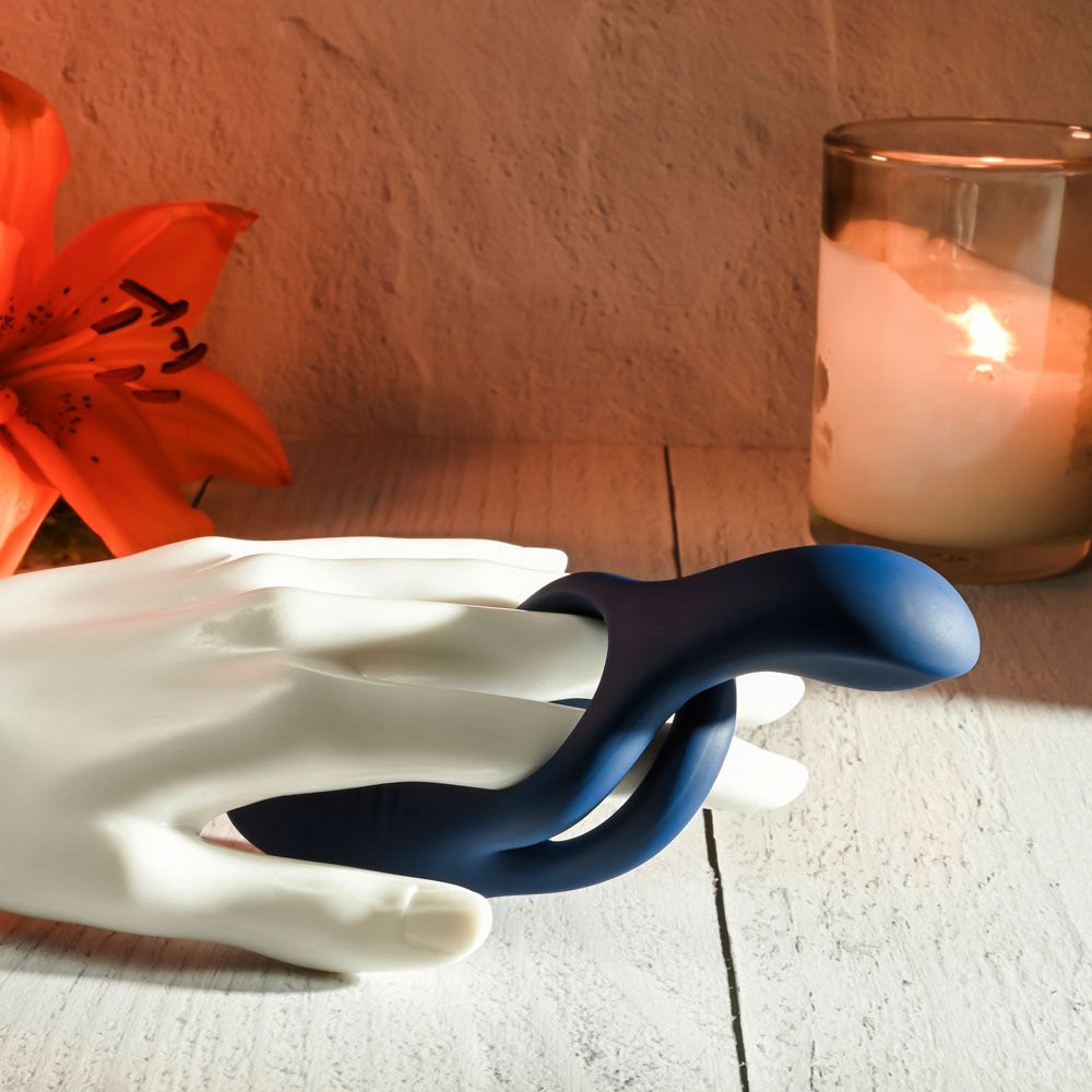 Zero tolerance - ring around the rosy - vibrating cock ring - Product side view, in a hand | Flirtybay